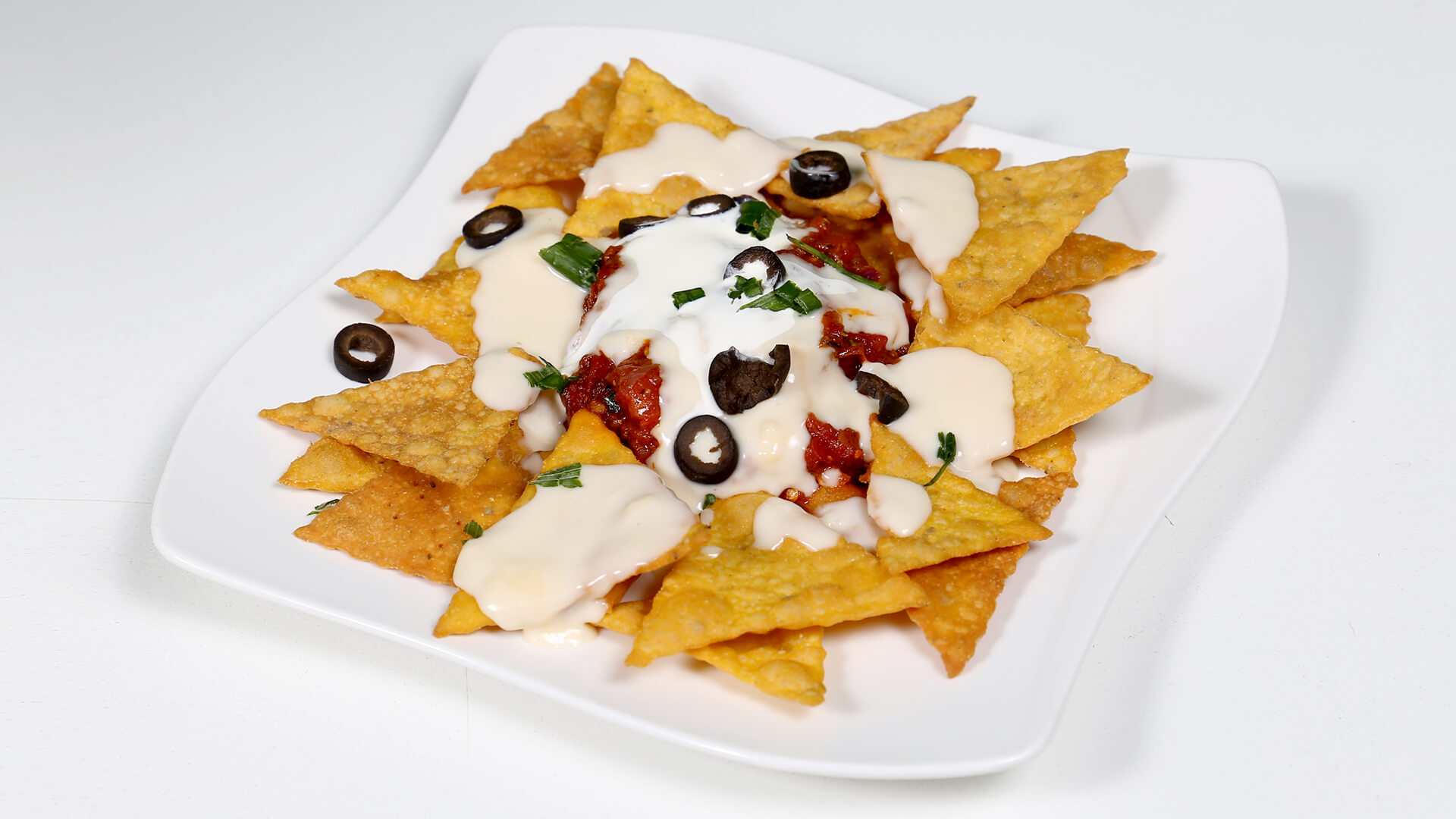 Nachos With Salsa And Cheese Sauce